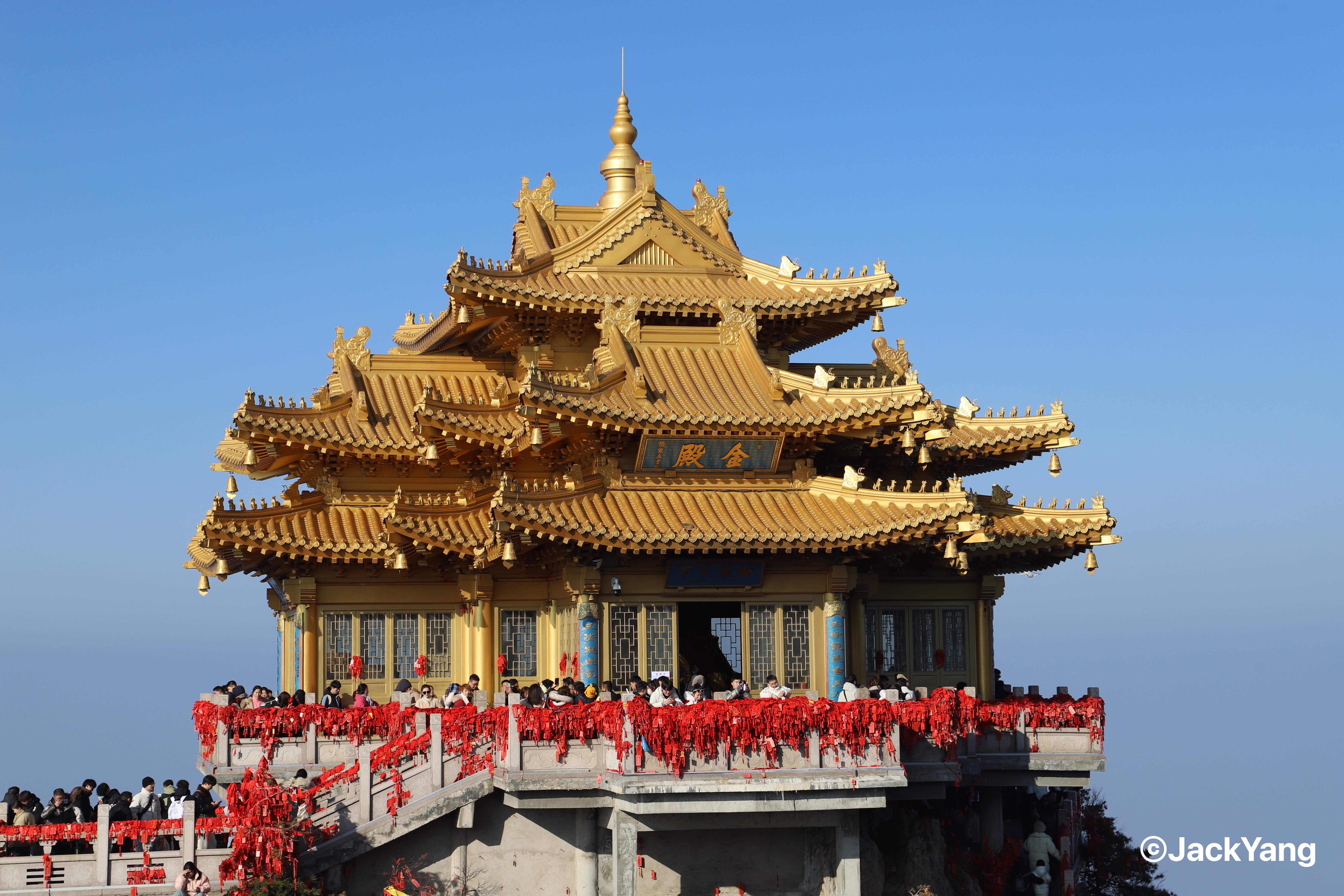 The golden-roofed Jindian temple beneath a clear blue sky